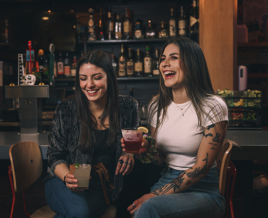 Girls Laughing With Drinks